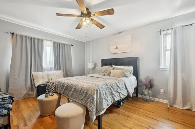 a bedroom with bed and a window