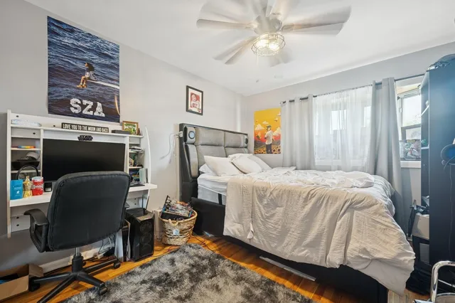 a bathroom with a granite countertop sink a toilet a mirror a vanity a bath tub and shower