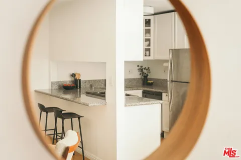 a kitchen with a refrigerator and washer