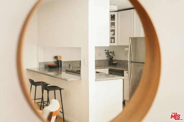 a kitchen with a refrigerator and washer