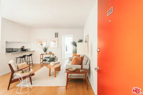 a living room with furniture and a table