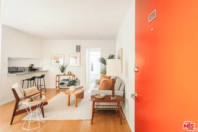 a living room with furniture and a table