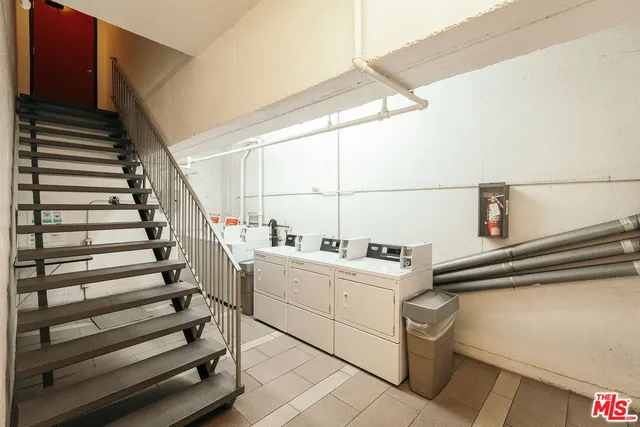 a view of storage and utility room with stairs