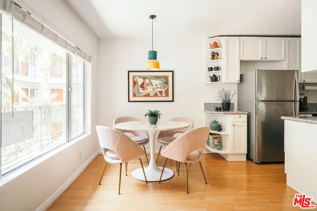 a view of a dining room with furniture window and kitchen view