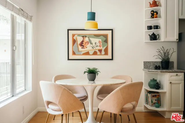 a view of a dining room with furniture window and wooden floor