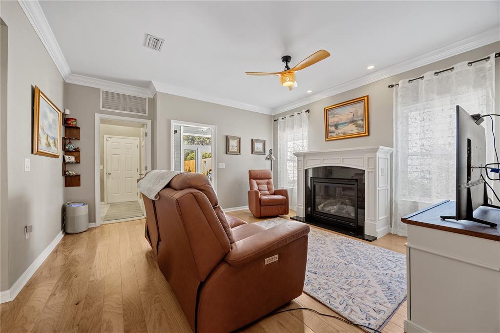 8267 Southwest 78th Lane Gainesville, FL 32608 - Photo 12 of 57 a living room with furniture and a fireplace