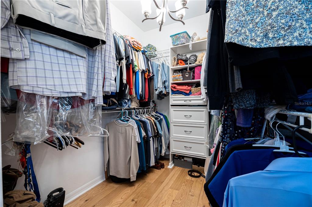 8267 Southwest 78th Lane Gainesville, FL 32608 - Photo 18 of 57 a view of walk in closet with clothes and shoes