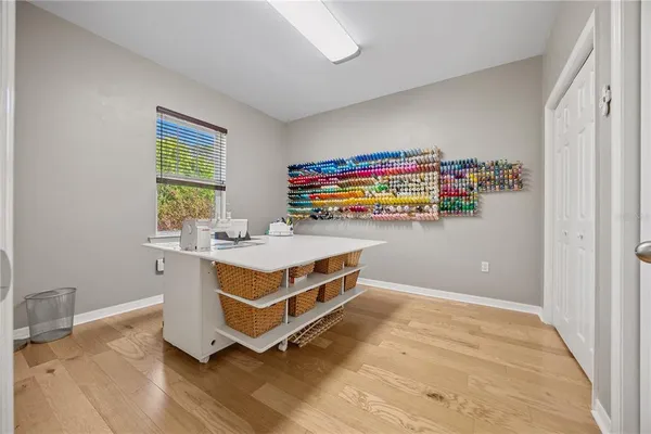 a bedroom with a bed and a chair in it