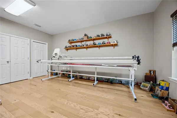 a room with gym equipment and a window