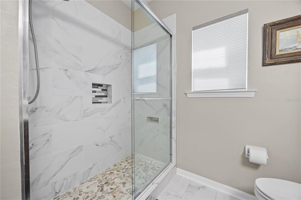 8267 Southwest 78th Lane Gainesville, FL 32608 - Photo 26 of 57 a bathroom with a shower and toilet