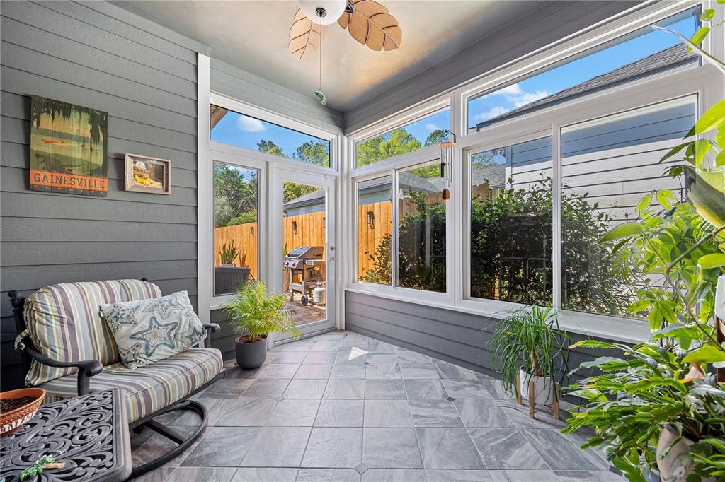 8267 Southwest 78th Lane Gainesville, FL 32608 - Photo 30 of 57 a living room filled with furniture and a large window