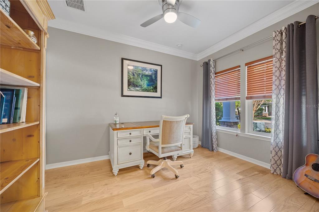 8267 Southwest 78th Lane Gainesville, FL 32608 - Photo 3 of 57 a view of a workspace with furniture and a window