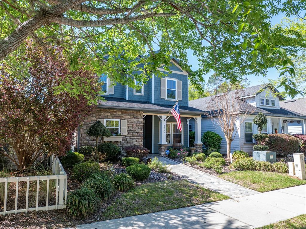 8267 Southwest 78th Lane Gainesville, FL 32608 - Photo 35 of 57 a front view of a house with garden