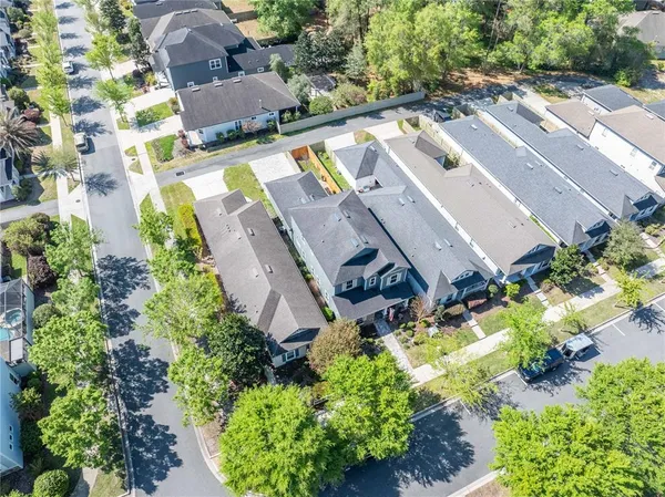 an aerial view of a house with outdoor space