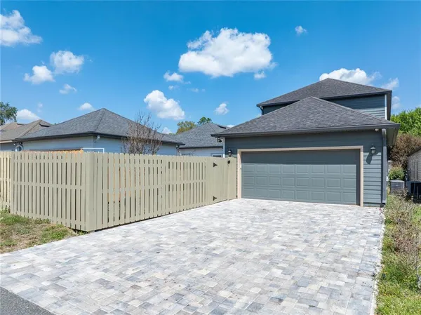 an aerial view of a house with a garden