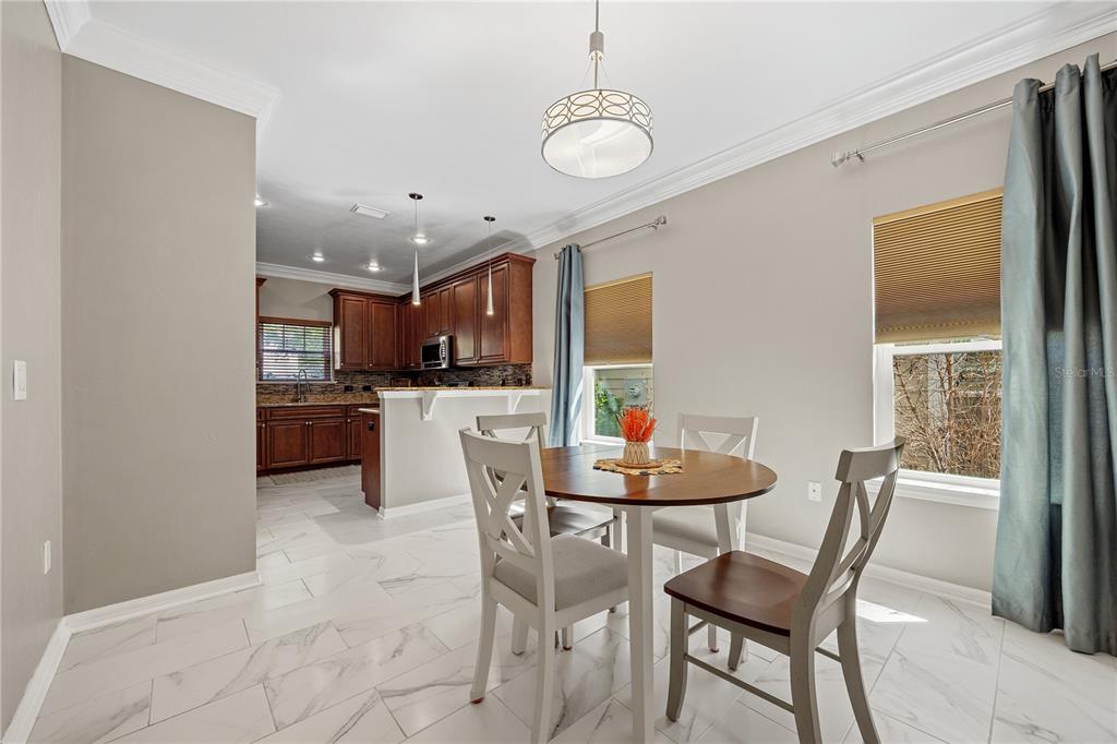 8267 Southwest 78th Lane Gainesville, FL 32608 - Photo 4 of 57 a dining room with furniture and window