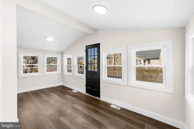 an empty room with windows