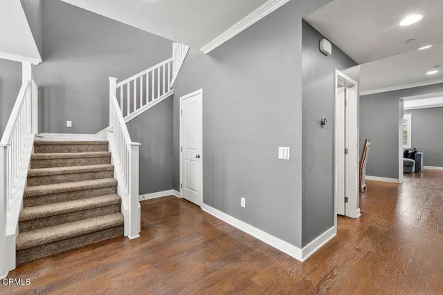 a view of entryway with wooden floor