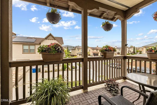 a view of a balcony with wooden floor