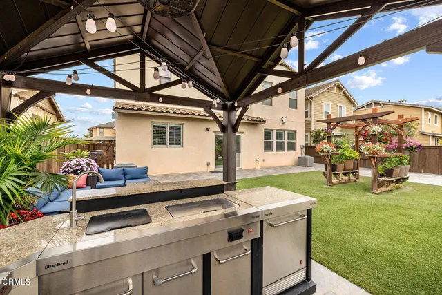 a view of a backyard with sitting area
