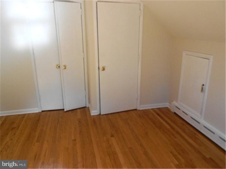 102 Devonshire Road Wilmington, DE 19803 - Photo 4 of 8 a view of an empty room with wooden floor