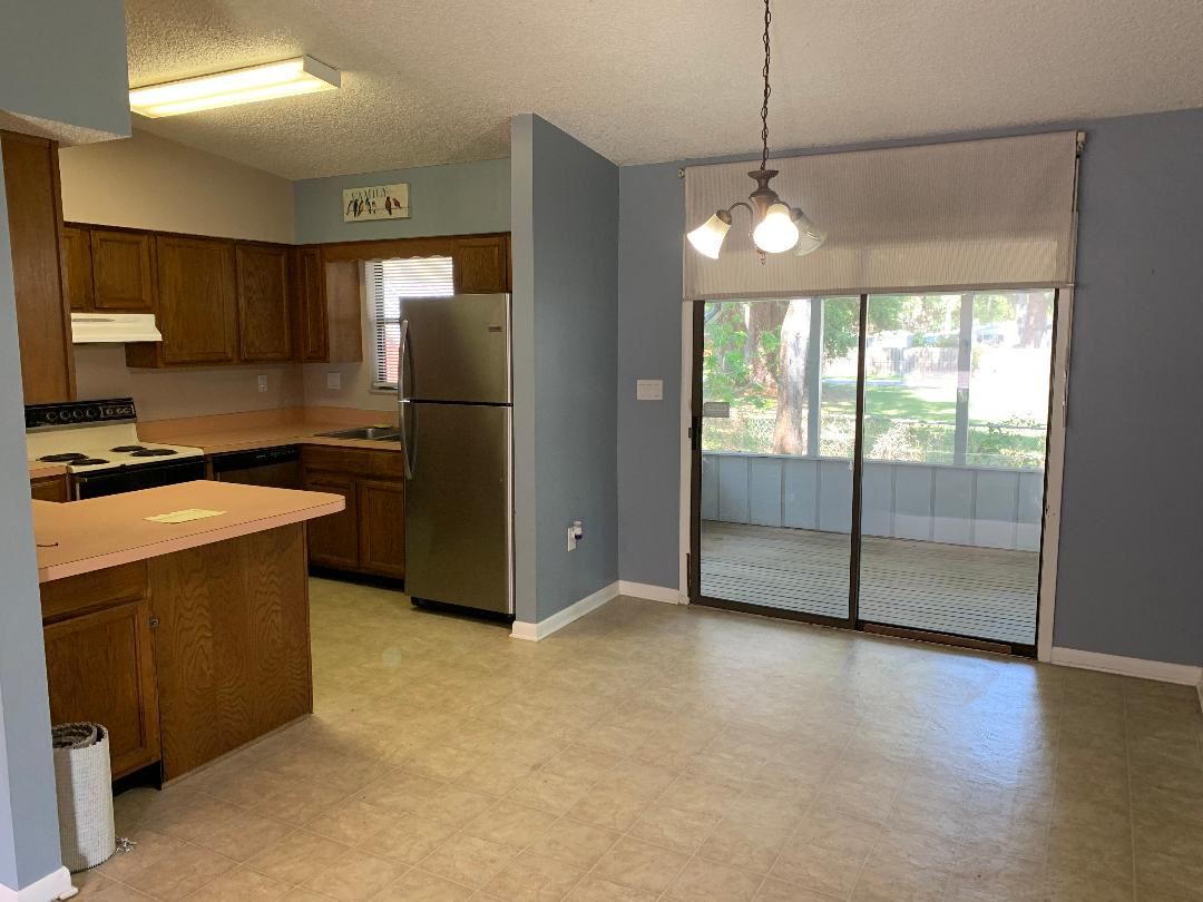 137 Nautilus Road St. Augustine, FL 32086 - Photo 5 of 12 a view of a kitchen with a stove and a refrigerator