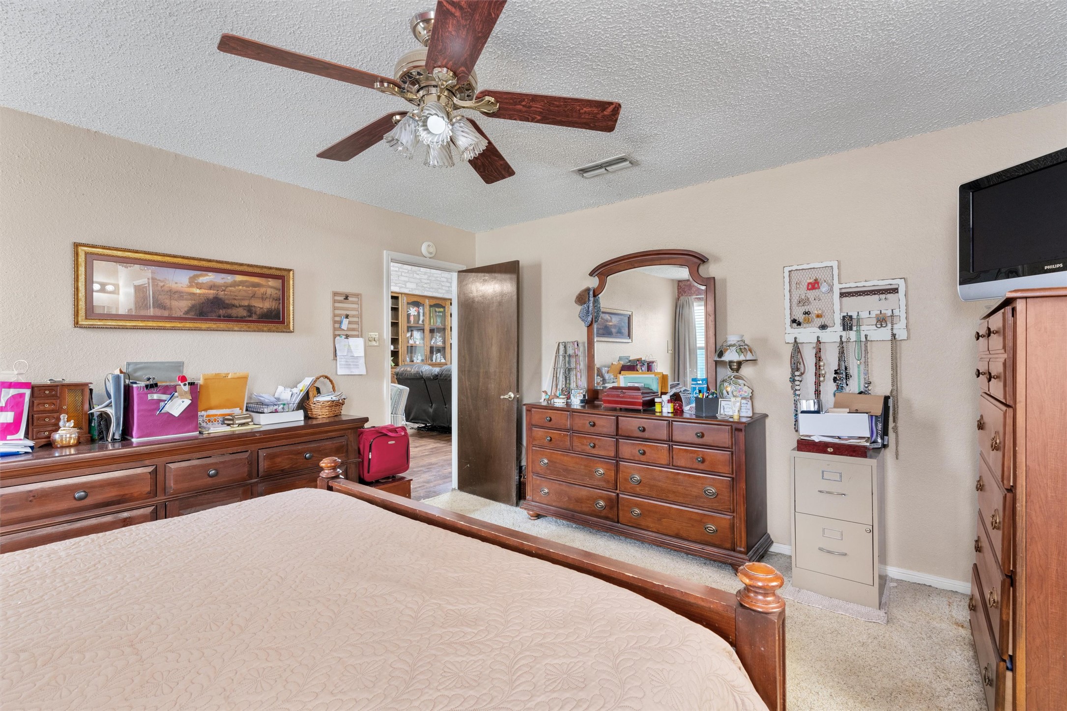 401 Drake Lane Taylor, TX 76574 - Photo 15 of 31 Neutral wall tones complement the ceiling fan with integrated lighting