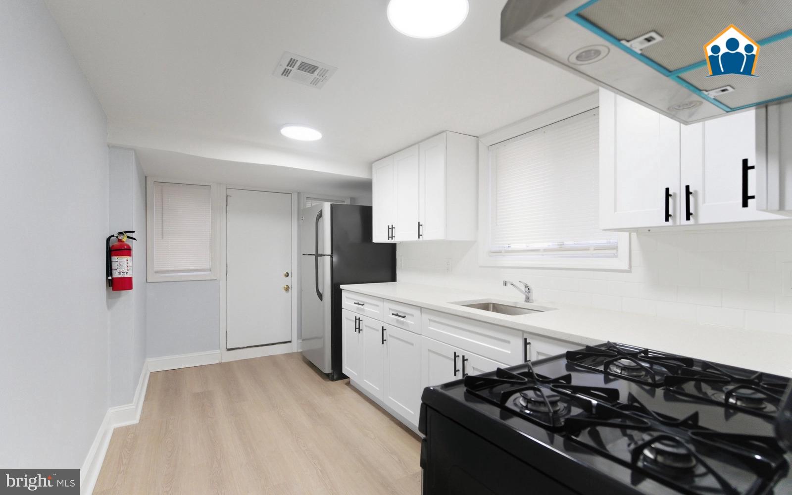 2625 Braddock Street Philadelphia, PA 19125 - Photo 3 of 7 a kitchen that has a sink and a stove