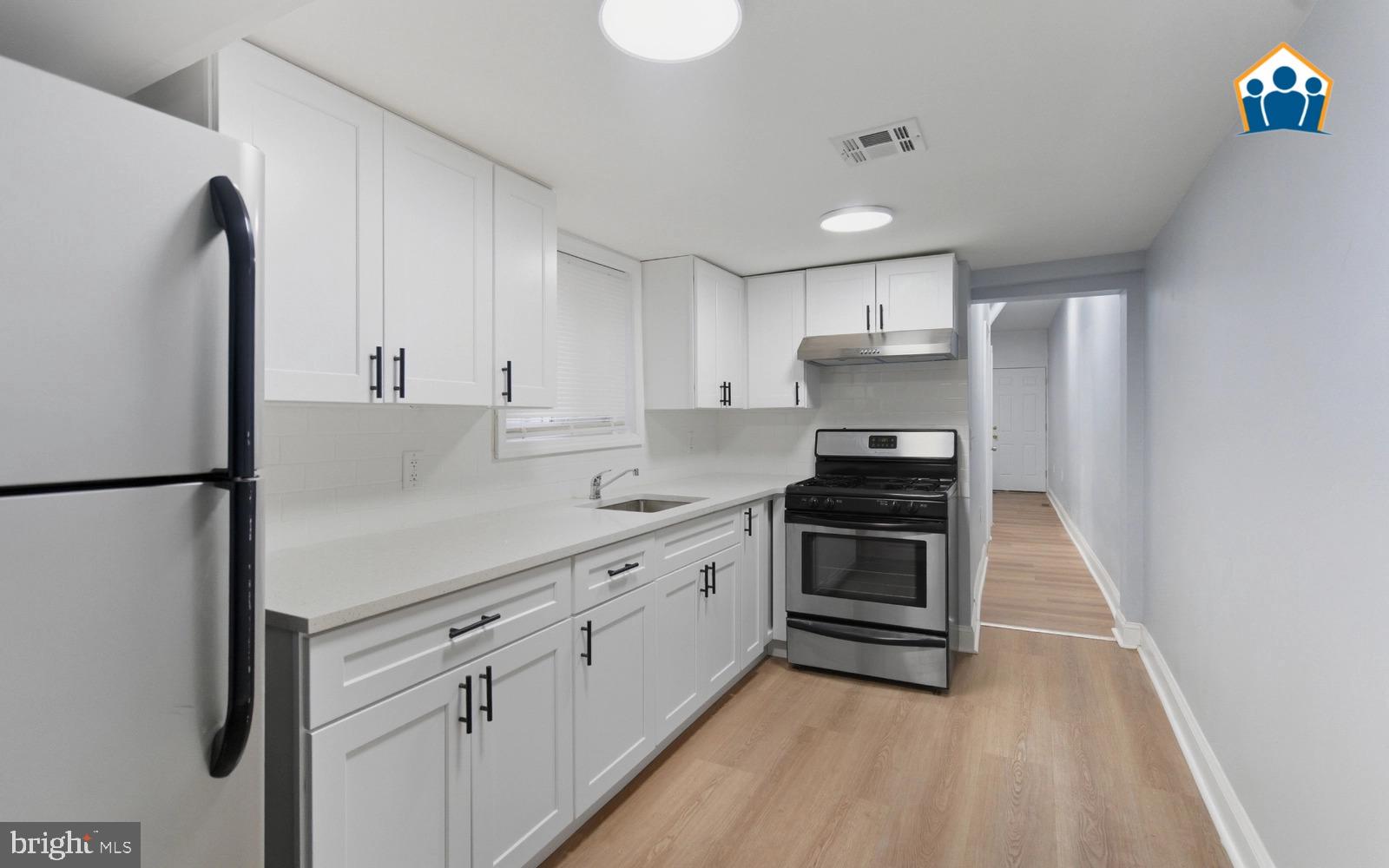 2625 Braddock Street Philadelphia, PA 19125 - Photo 4 of 7 a kitchen with a refrigerator and a sink