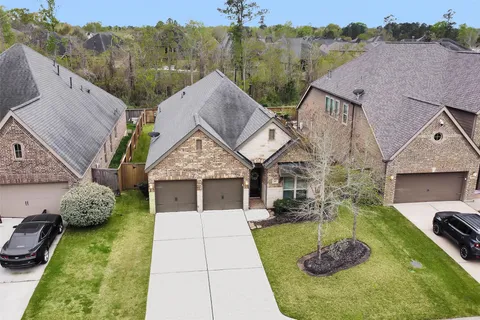 a aerial view of a house with a yard