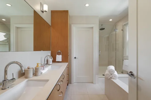 a bathroom with a double vanity sink