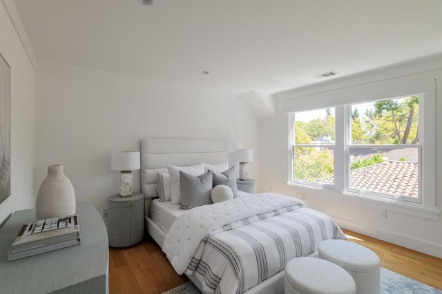 a bedroom with bed and window