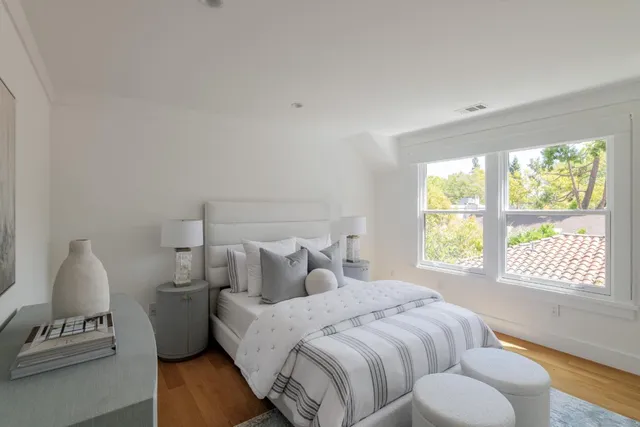 a bedroom with bed and window