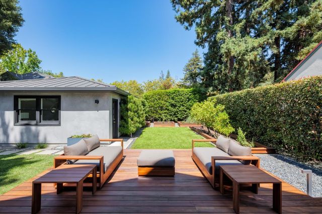 a backyard of a house with seating space