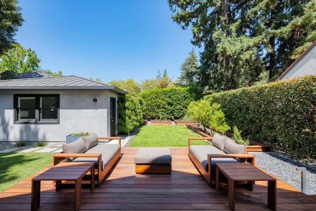 a backyard of a house with seating space