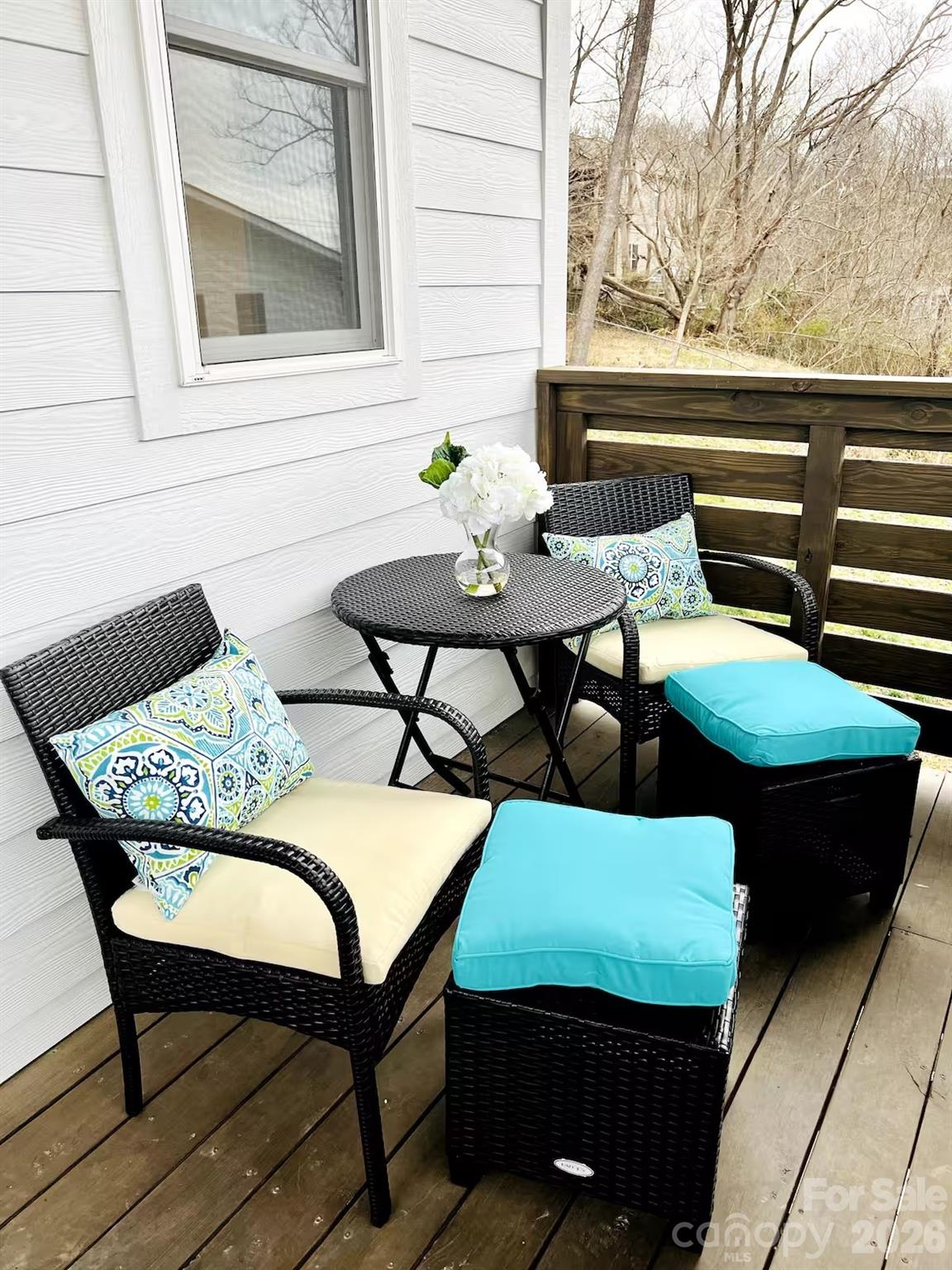 1063 Riverside Drive Asheville, NC 28804 - Photo 18 of 40 a outdoor sitting area with furniture and wooden floor