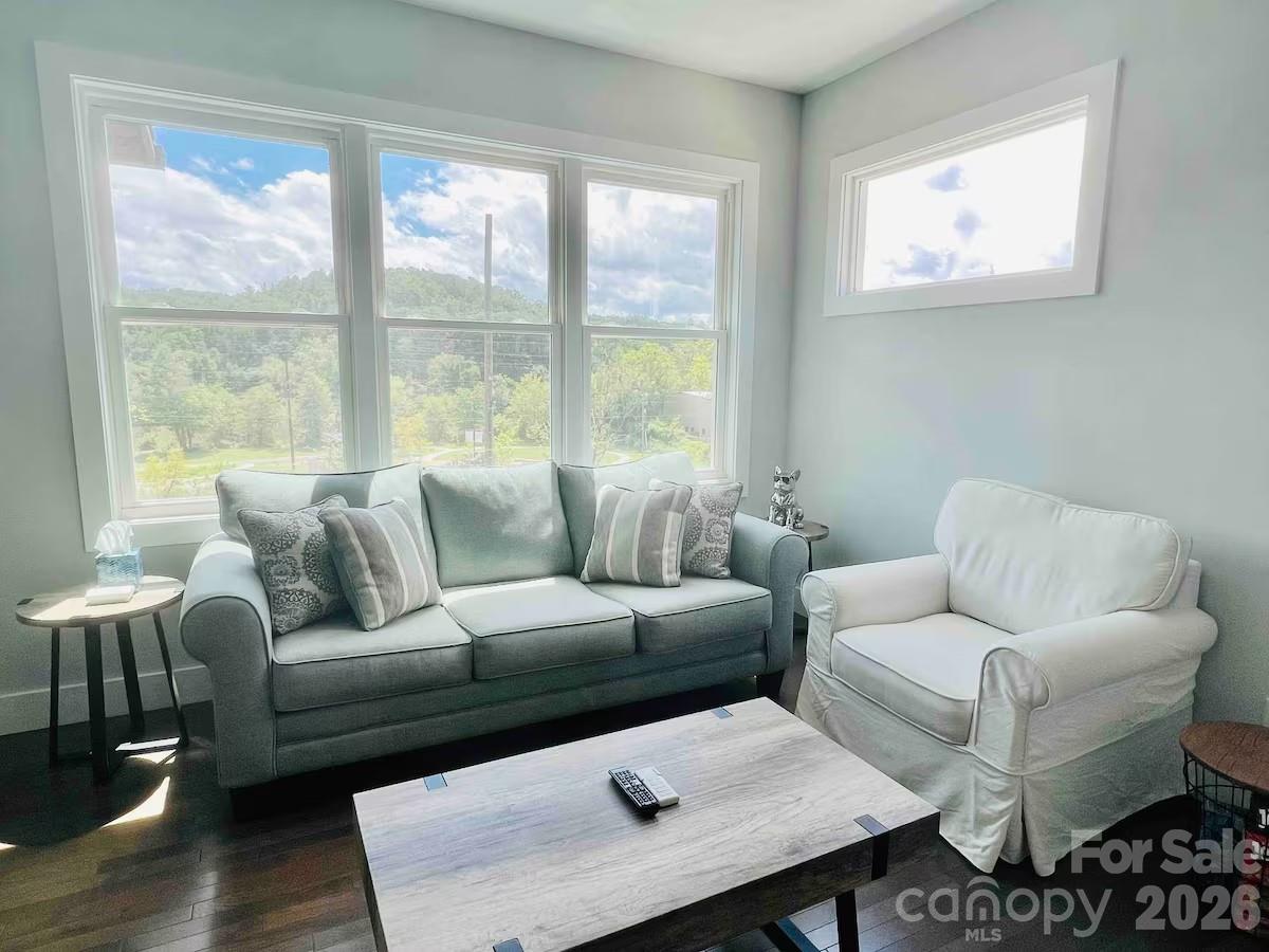 1063 Riverside Drive Asheville, NC 28804 - Photo 4 of 40 a living room with furniture and a large window
