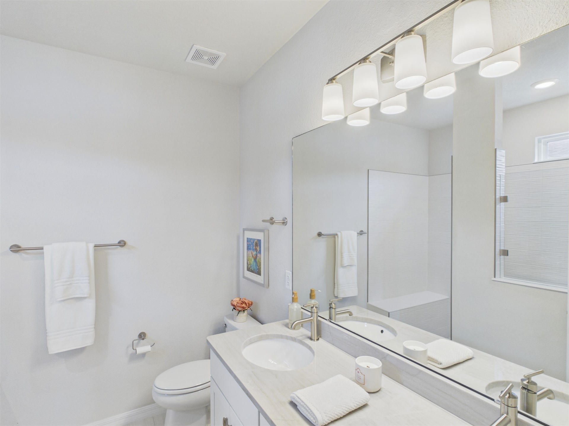 312 Salt Meadow Loop Yulee, FL 32097 - Photo 12 of 22 a bathroom with a sink vanity mirror and toilet