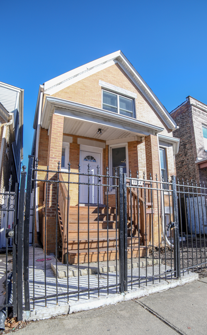 1127 North Ridgeway Avenue Chicago, IL 60651 - Photo 1 of 24 a front view of a house