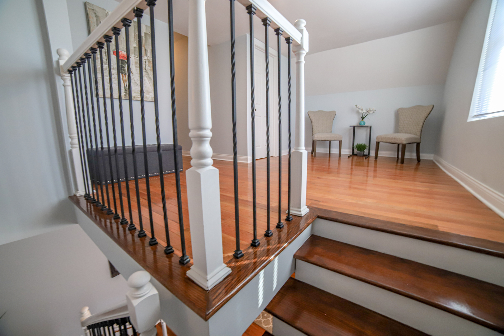 1127 North Ridgeway Avenue Chicago, IL 60651 - Photo 14 of 24 a view of a room with wooden floor stairs and a dining room view