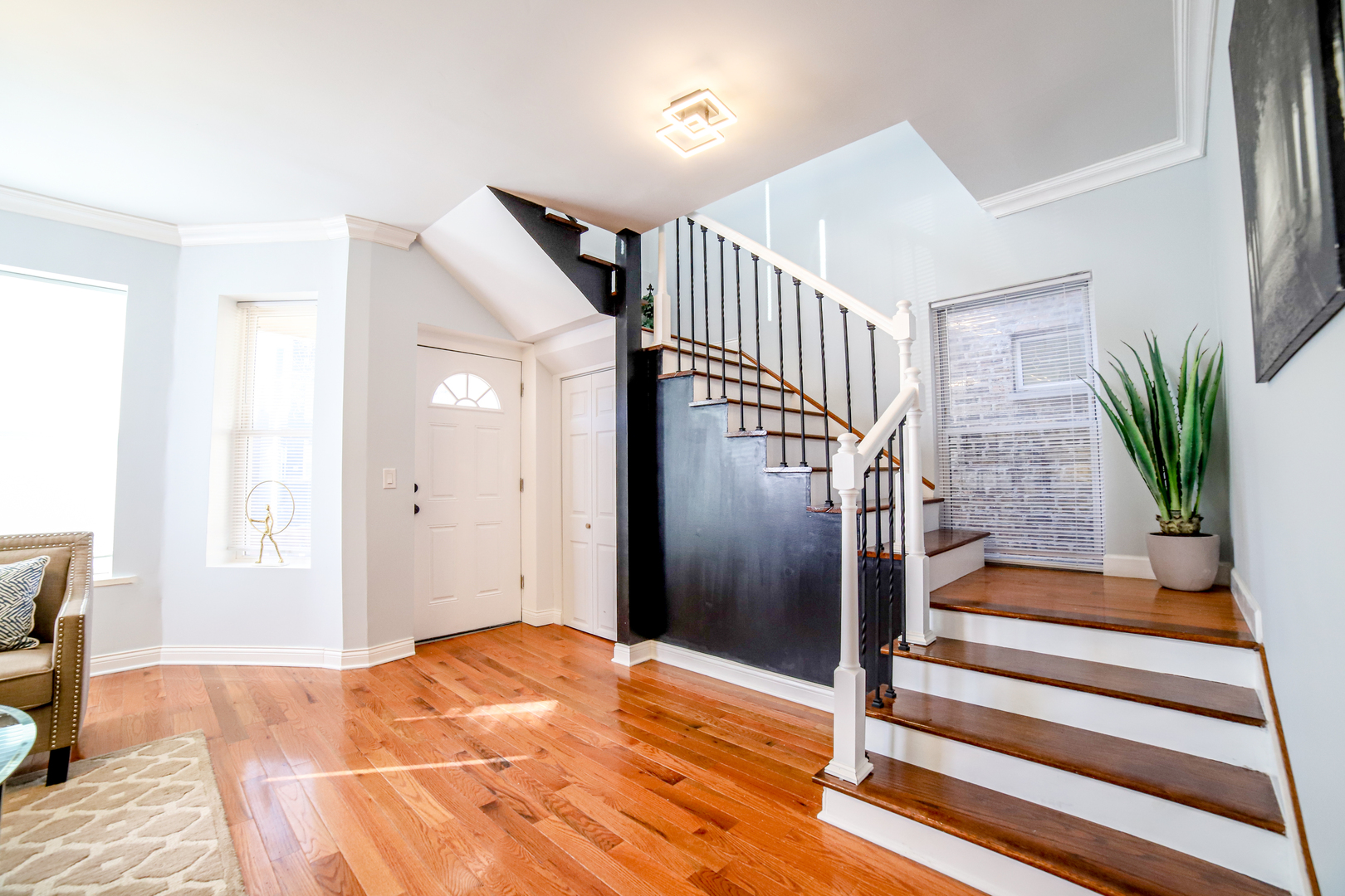 1127 North Ridgeway Avenue Chicago, IL 60651 - Photo 2 of 24 a view of entryway bedroom and hall with wooden floor