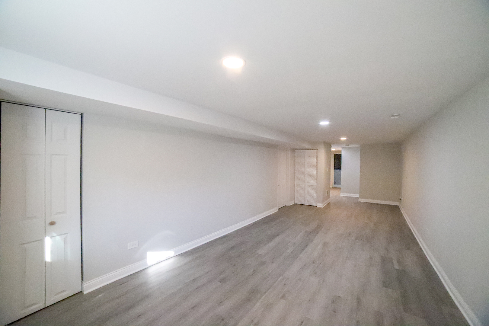 1127 North Ridgeway Avenue Chicago, IL 60651 - Photo 21 of 24 an empty room with wooden floor and windows