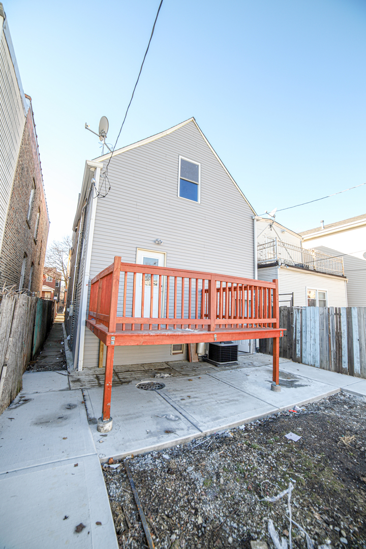 1127 North Ridgeway Avenue Chicago, IL 60651 - Photo 23 of 24 a view of a backyard with a sitting area