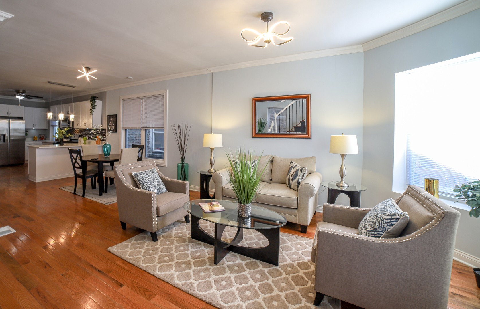 1127 North Ridgeway Avenue Chicago, IL 60651 - Photo 4 of 24 a living room with furniture and a chandelier