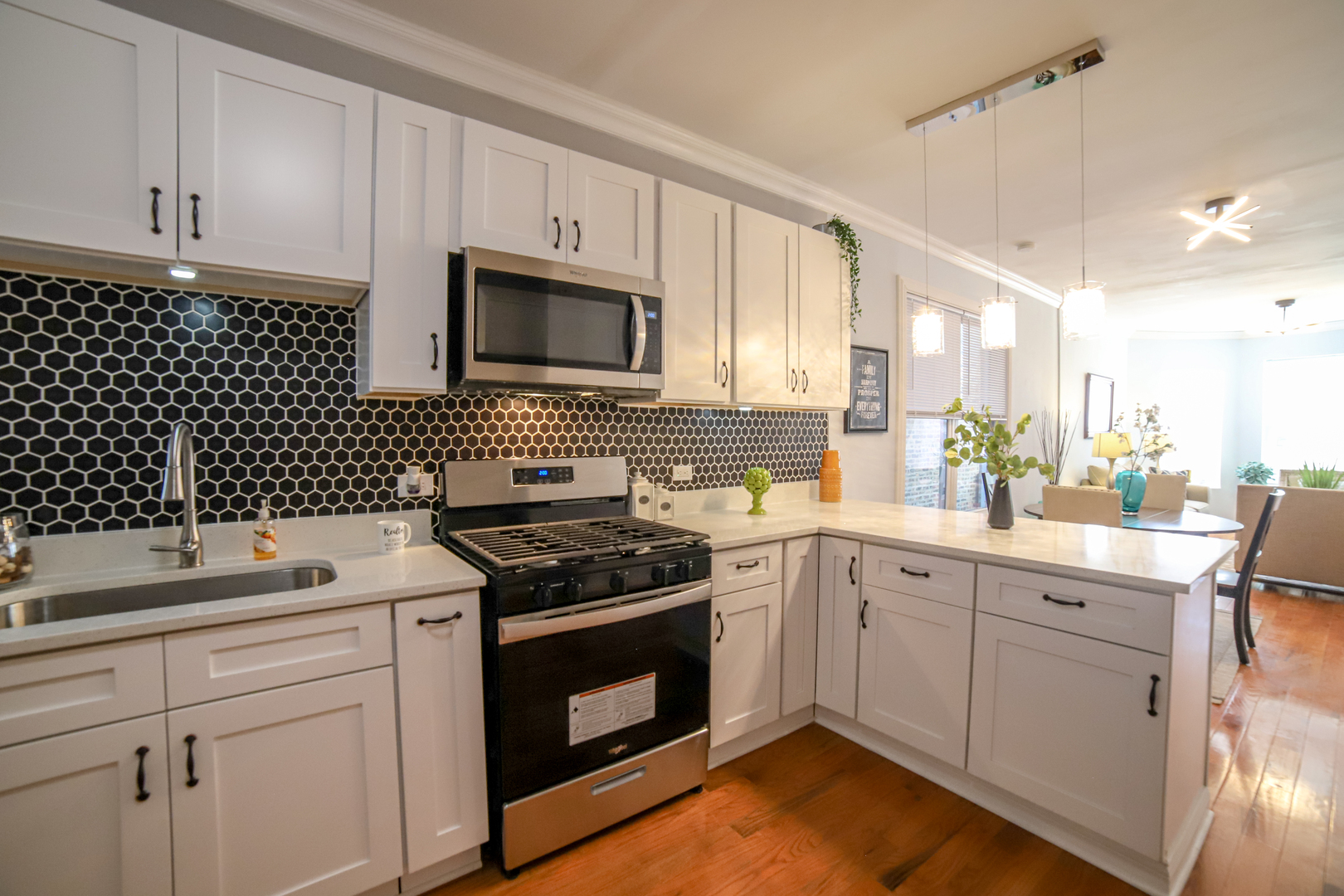 1127 North Ridgeway Avenue Chicago, IL 60651 - Photo 8 of 24 a kitchen with a sink stove and cabinets