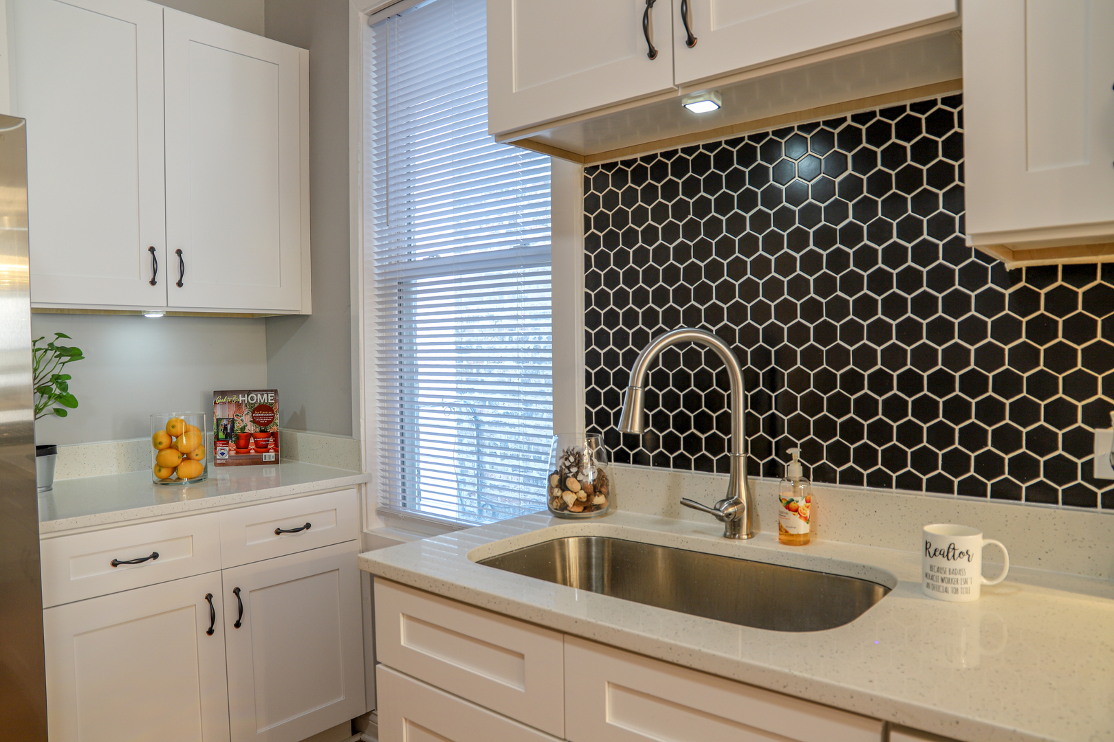 1127 North Ridgeway Avenue Chicago, IL 60651 - Photo 9 of 24 a bathroom with a sink a vanity and window