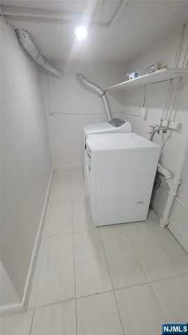 a view of a utility room with washer and dryer