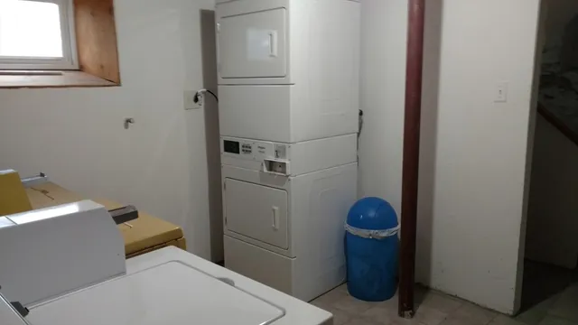 a bathroom with a toilet and shower