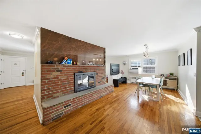 a view of a dining room with furniture and a large window