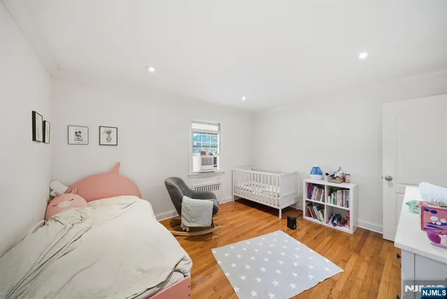 a bathroom with a granite countertop toilet sink and mirror
